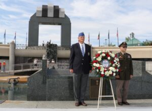 Retired Brig. Gen. Peter C. Hinz and Col. Christopher J. Samulski place the wreath honoring all U.S. forces June 6, 2021, during the observation of the 77th anniversary D-Day at the National D-Day Memorial in Bedford, Virginia.