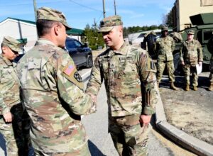 Soldiers assigned to the 229th Military Police Company receive challenge coins