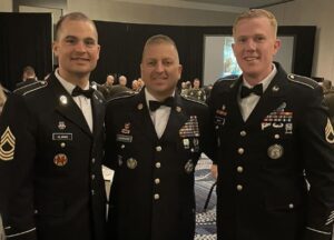 Master Sgt. Thomas Clarke Jr., Sgt. Maj. Paul Johnson and Staff Sgt. Sydney Mapp pose together at the Director of the Army National Guard’s Strength Maintenance Conference March 23, 2023, in New Orleans, Louisiana.