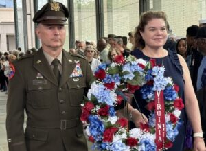 Maj. Gen. James W. Ring, the Adjutant General of Virginia, and his wife Rev. Leigh Anne Ring place the Virginia National Guard memorial wreath to honor fallen VNG Soldiers and Airmen May 27, 2024, at the Virginia War Memorial in Richmond, Virginia.