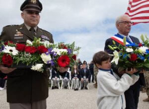 Maj. Gen. Joseph A. Dinonno, Commanding General of the 29th Infantry Division, lays a wreath along with a French dignitary June 2, 2024, at the National Guard Monument situated above Omaha Beach in Vierville-sur-Mer, France.