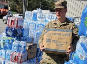 A Virginia National Guard Soldier assigned to the Cedar Bluff-based 1033rd Engineer Company, 276th Engineer Battalion, 329th Regional Support Group assists with food and water distribution Oct. 6, 2024, in Damascus, Virginia