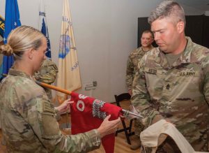 The 180th Engineer Support Company command team unfurls their unit guidon to mark the official start of their federal active duty mission in the Horn of Africa Oct. 20, 2025, at Camp Lemonnier, Djibouti.